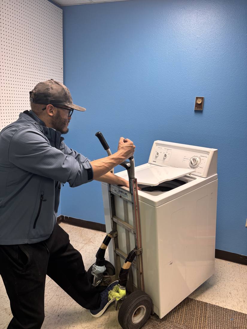Moving a top-load washer on a hand truck