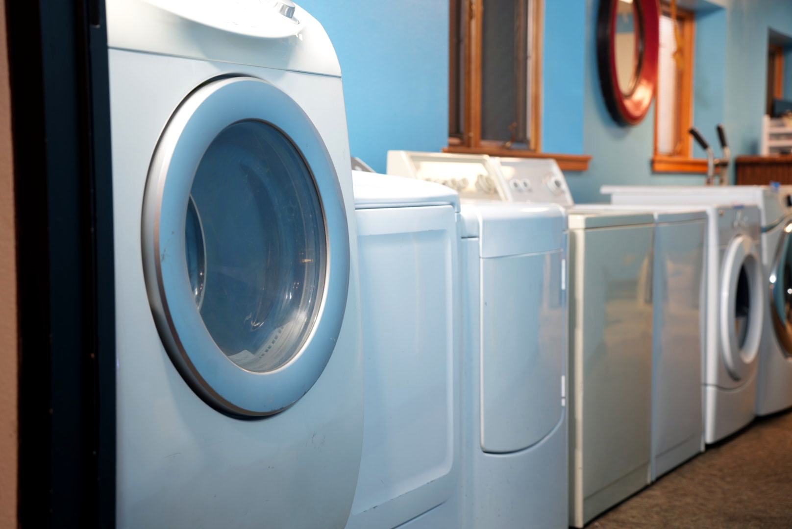 Refurbished washers and dryers lined up in our Rifle shop